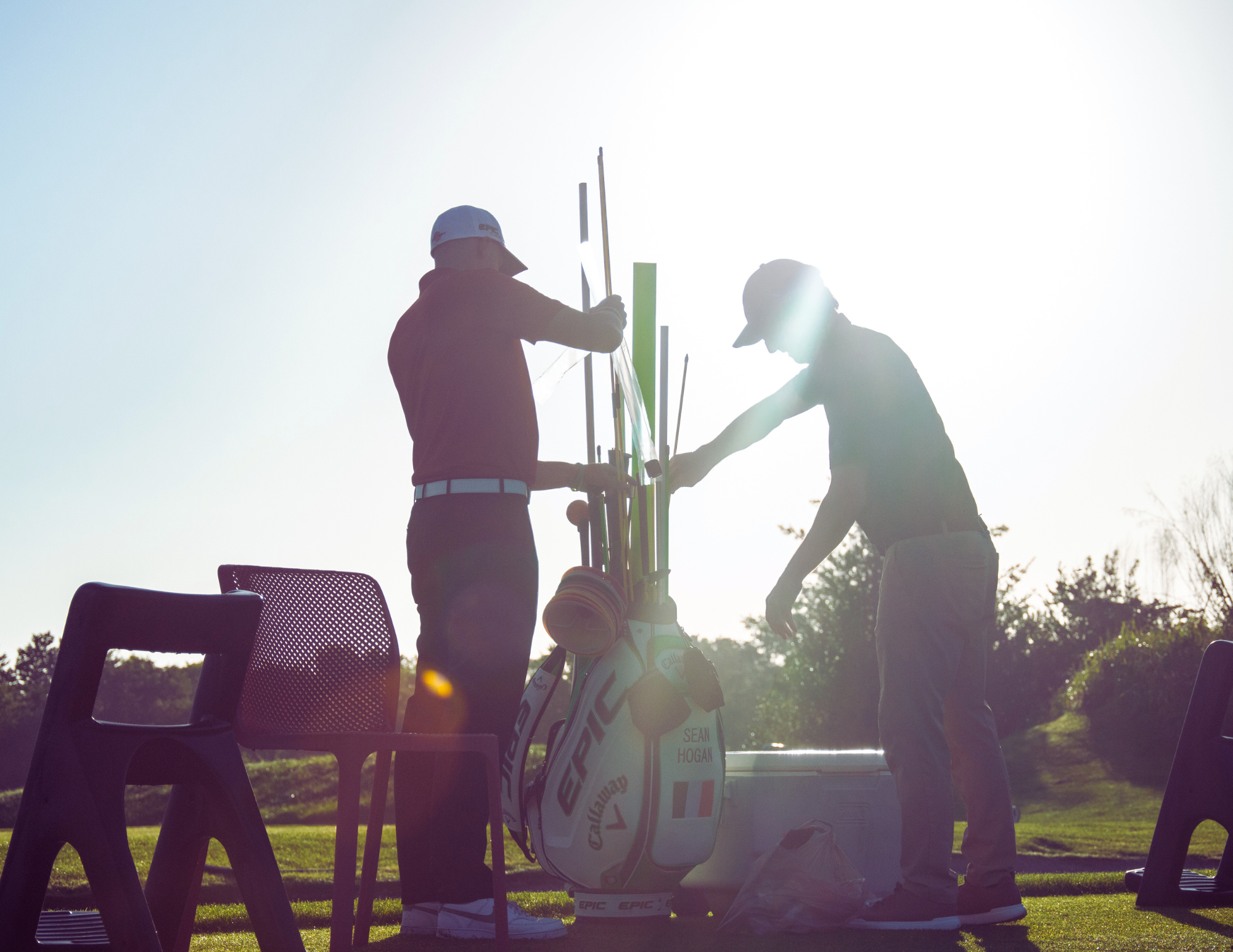 Instructor Sean Hogan choosing his training tool for his next golf lesson